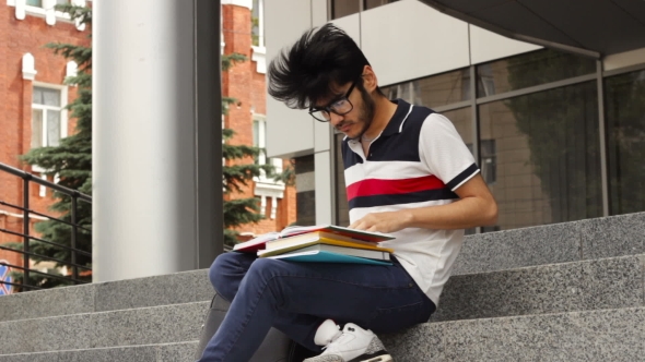 Man Asian Student Sitting on Stairs and Reading Book