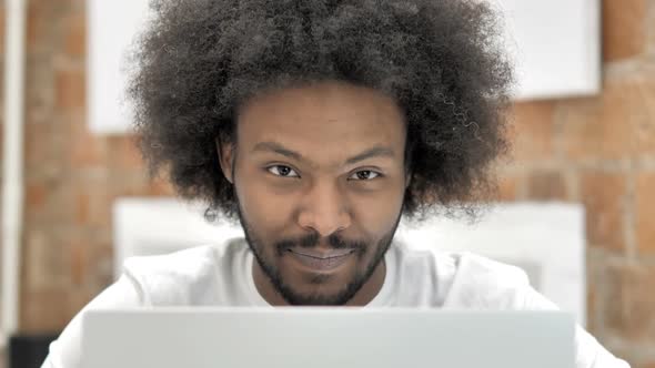 Smiling Creative Man Frontal View alt