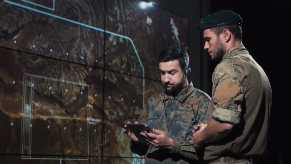 Military Men Calculating Location for Missile Launch alt