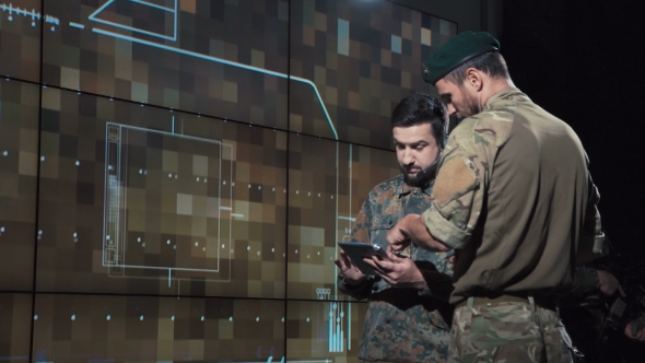 Military Men Calculating Location for Missile Launch alt