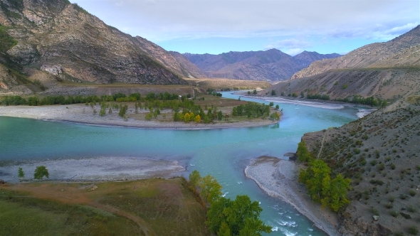 Aerial Footage of a Blue River Running in a Mountain Valley