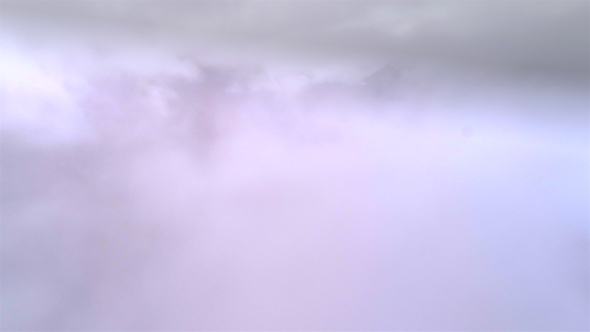 Aerial Footage of a Cloudy Mountain Valley. Flying Above