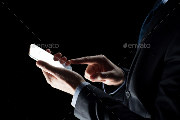 close up of businessman with glass smartphone