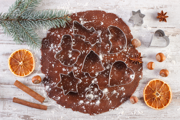 Dough for Christmas cookies, spice and ingredient for baking gingerbread on rustic plank - Stock Photo - Images