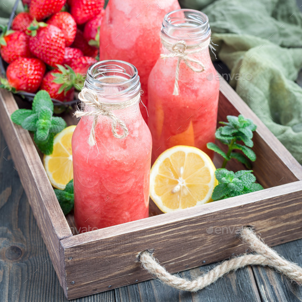 Blended lemonade with fresh strawberry, lemon, ice and mint, square