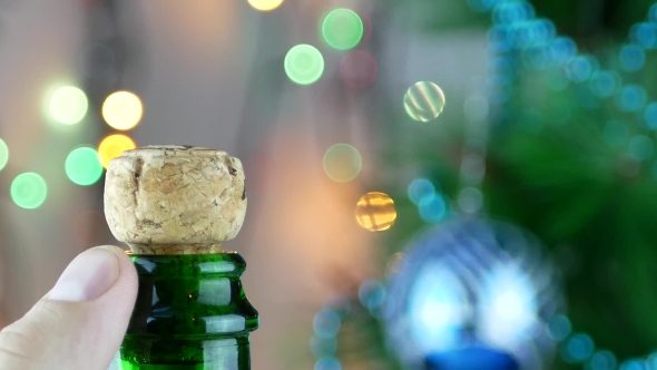 Man's Hand Opening Champagne Bottle