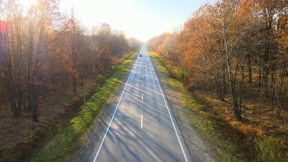 Aerial View of Cargo Trucks Driving on Highway Hauling Goods alt