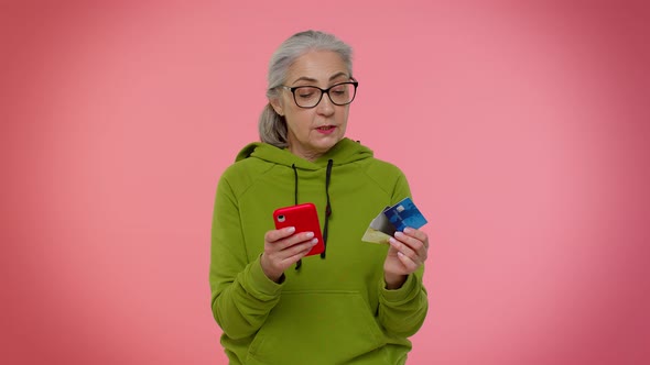Senior Old Granny Woman Using Credit Plastic Cards and Mobile Phone Purchases Online Shopping alt
