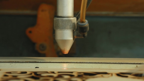 Machine for Laser Cutting Wood  Cuts Chipboard and the Smoke Appears alt
