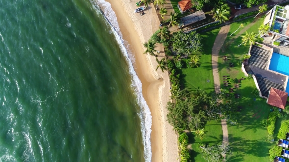 Aerial of Sea Waves and Sandy Beach Near the Hotel That Washing By Sea Waves in Sri Lanka