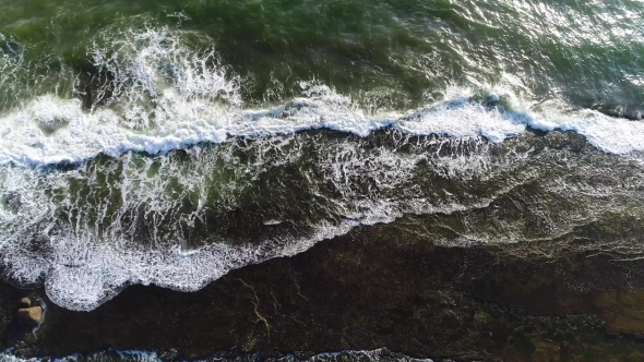 Aerial Shot of Sea Waves That Break Down on the Rocky Ledge in the Sea in Sri Lanka