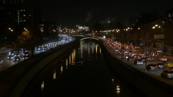 The Movement of Vehicles on the River Waterfront In Evening Time. alt
