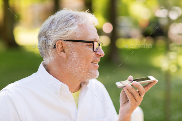 old man using voice command recorder on smartphone