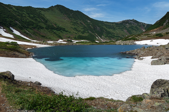 Summer Mountains of Kamchatka Peninsula - Blue Lake, Snow and Ice along Shores - Stock Photo - Images