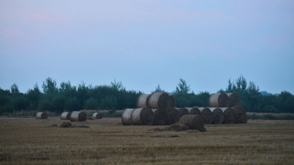 Tractor Stores Straw Bales