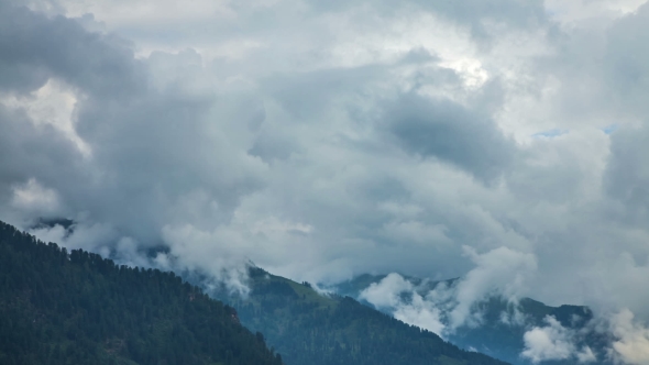 Beautiful Mist Swirls Over the Majestic Mountains