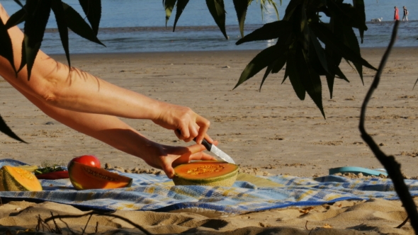 Picnic on a River Beach - Cutting Melon