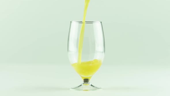 Juice Pouring Into Goblet Isolated on White Background alt