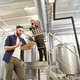 men with clipboard at brewery or beer plant - PhotoDune Item for Sale