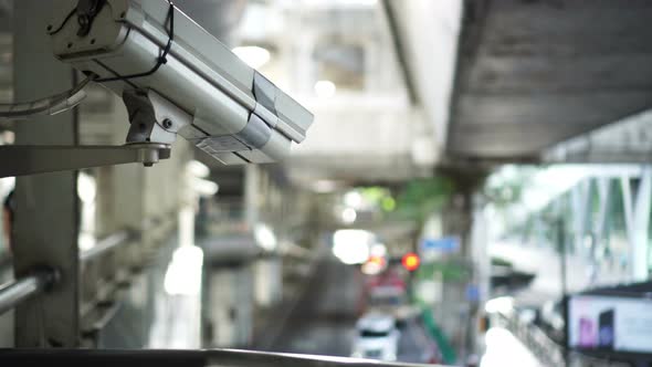 City cctv surveillance over street, people and public traffic video 4k