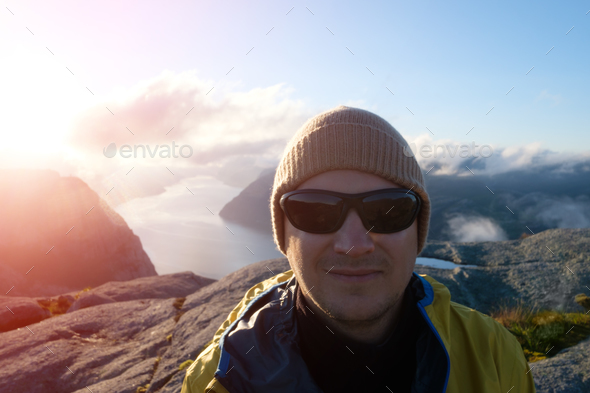 Traveler portrait on Lysefjorden fjord - Stock Photo - Images