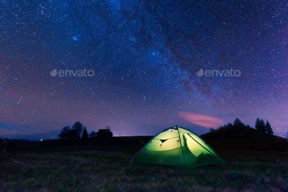 Green tent lighted from the inside - Stock Photo - Images