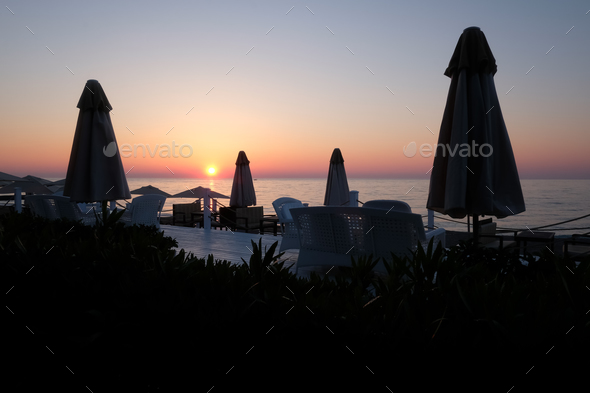 Sunshade umbrella on sea beach - Stock Photo - Images