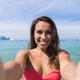 Attractive Young Caucasian Woman In Swimsuit On Beach Taking Selfie Photo, Girl Blue Sea Water - PhotoDune Item for Sale