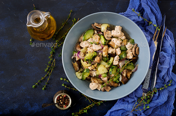 Delicate slices of chicken fillet with zucchini and mushrooms stewed - Stock Photo - Images