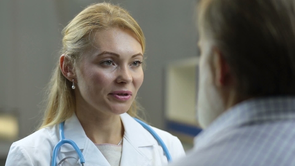 Positive Physician Telling Good News To Patient alt