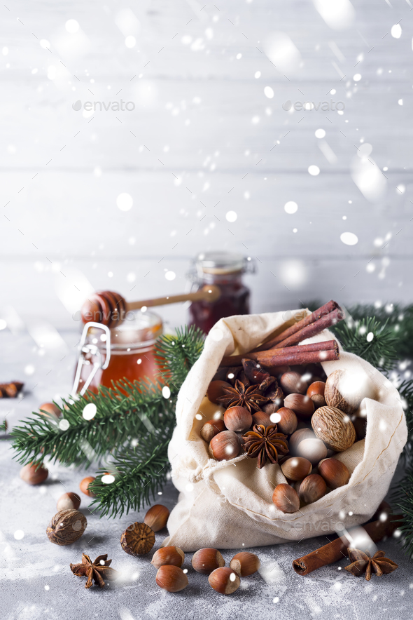 Fresh whole nuts and spices spilling - Stock Photo - Images
