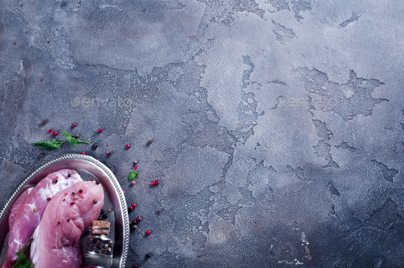 Raw fresh meat steak entrecote and seasonings in the iron plate with oil, chili, spices dill - Stock Photo - Images