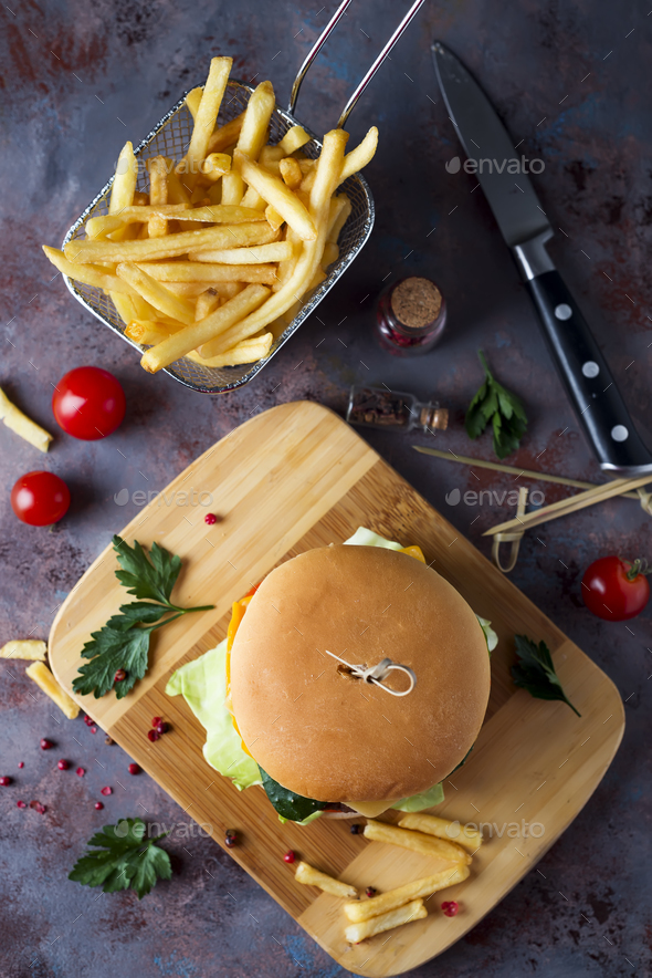 Hamburger with french fries, beer on a stone table - Stock Photo - Images