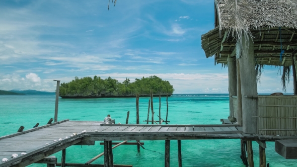Homstay Hut in Beautiful Blue Lagoone and Some Island in Background