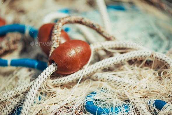 Pile of commercial fishing net with cords and floats Stock Photo