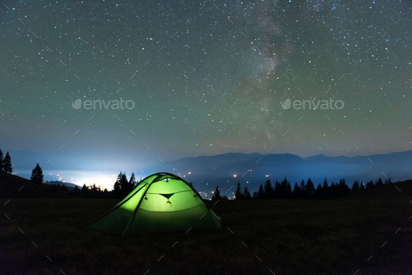 Green tent lighted from the inside - Stock Photo - Images
