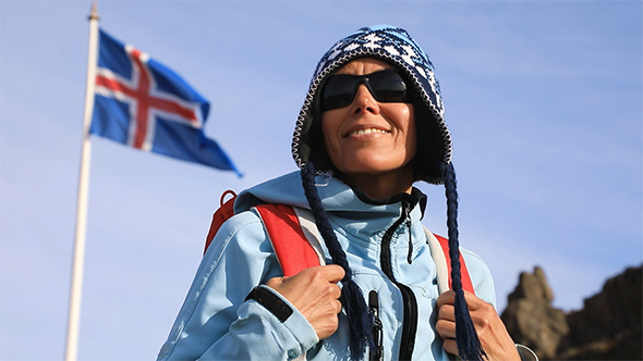 Portrait of Woman With Iceland Flag Waving in Wind