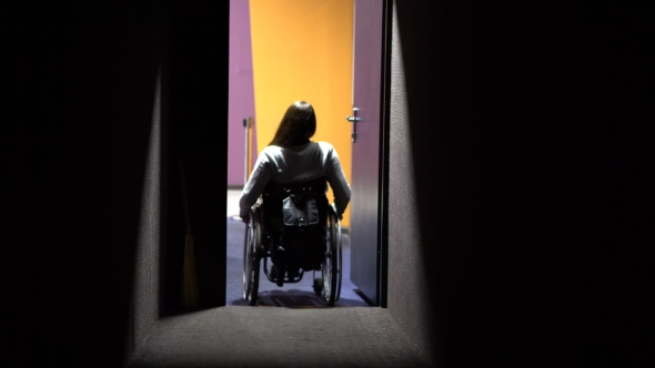 The Girl on a Wheelchair Comes Out of the Cinema