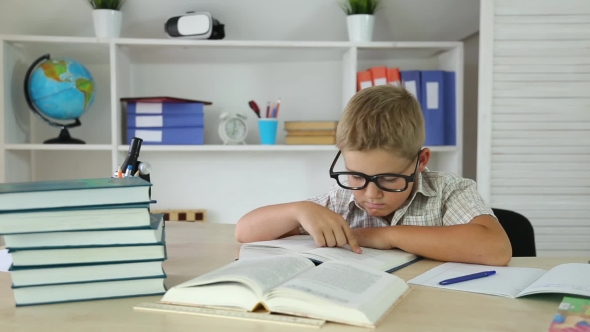 Clever Boy with Glasses Reading a Book and Found the Correct Answer alt