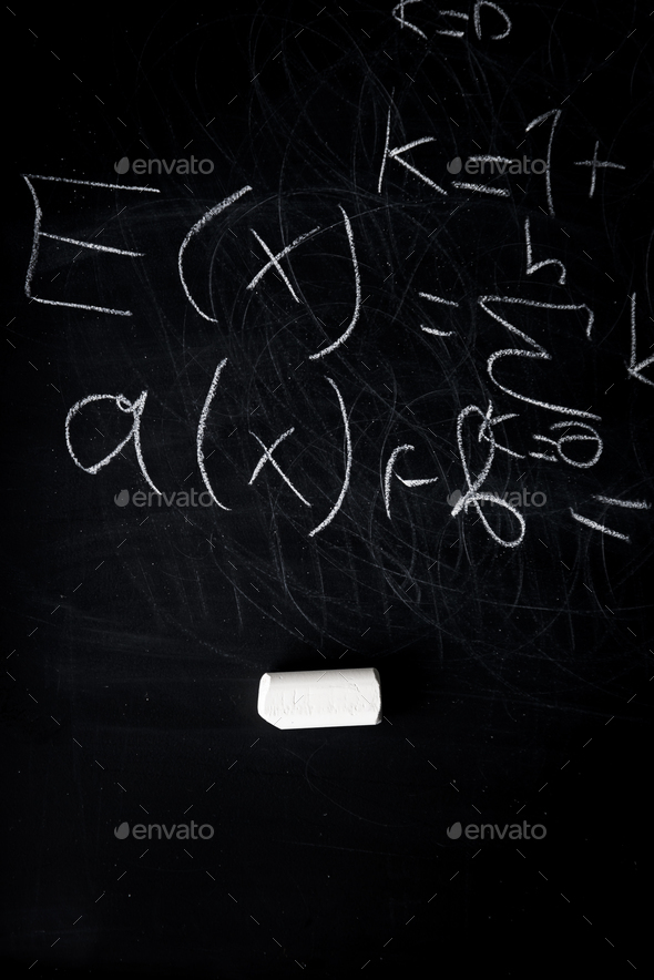 Part of maths formulas written by white chalk on the blackboard background.  Stock Photo by gargantiopa