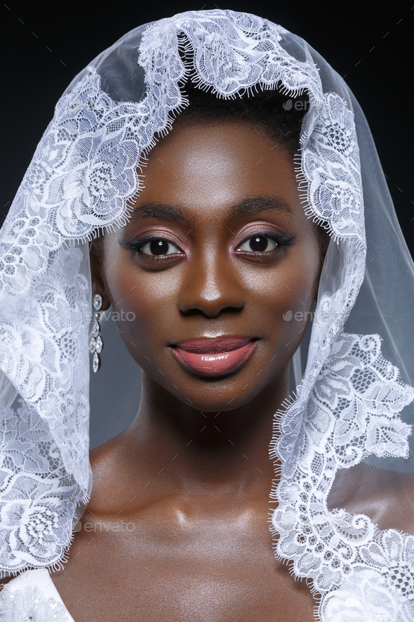 Beautiful african girl with veil hat