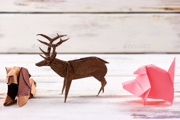 Animal figurines on wooden background