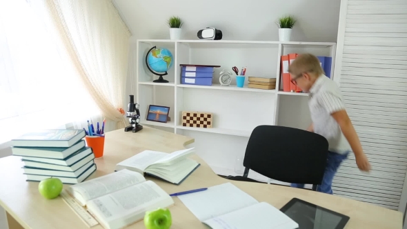 Happy Smiling Boy Having Fun Dancing in the Classroom on a School Break alt