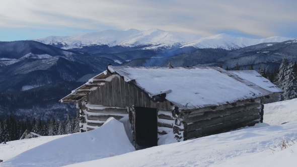 Snowstorm in Winter Mountains