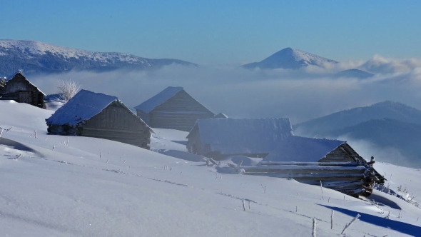 Snowstorm in Winter Mountains