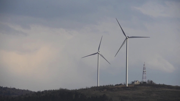 Wind Turbine on Sunset Background