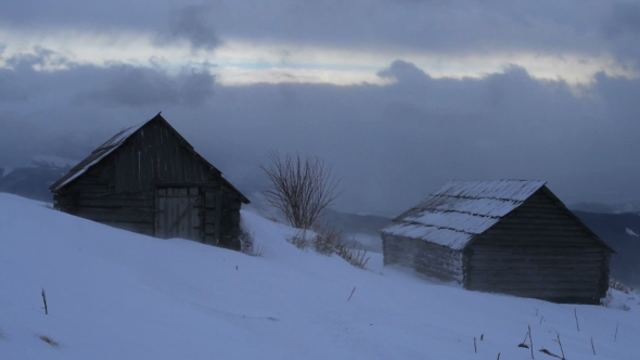 Snowstorm in Winter Mountains