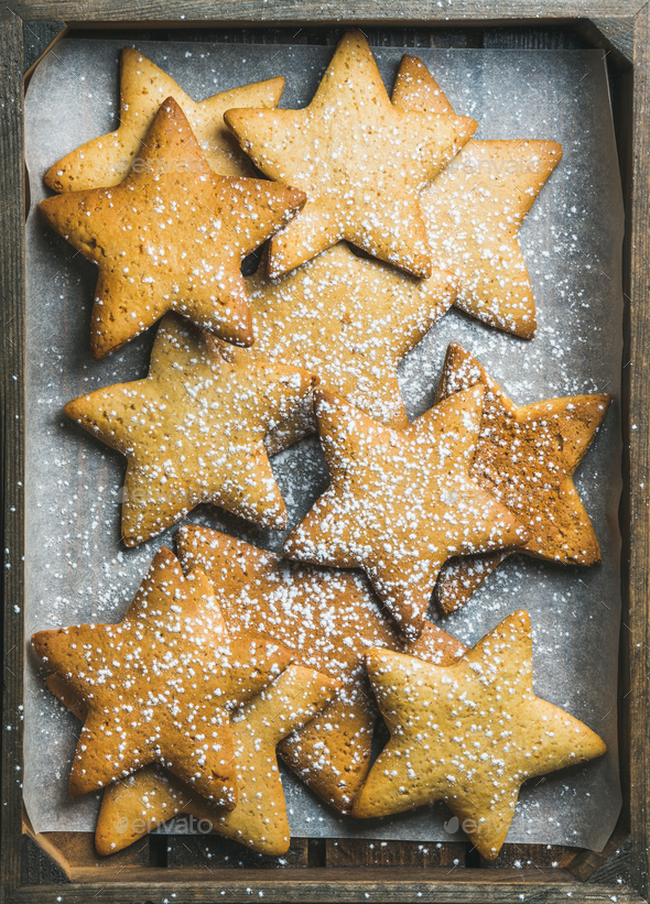Christmas gingerbread cookies in shape of stars with sugar powder - Stock Photo - Images