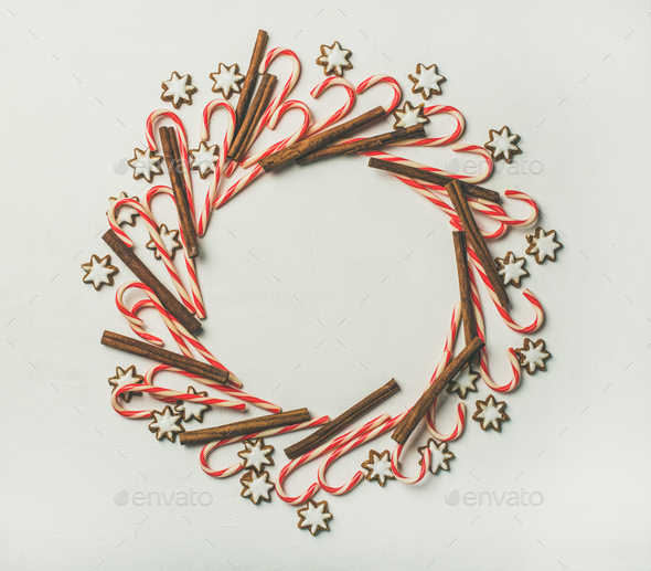Christmas wreath pattern made from candy cane sticks and cinnamon - Stock Photo - Images