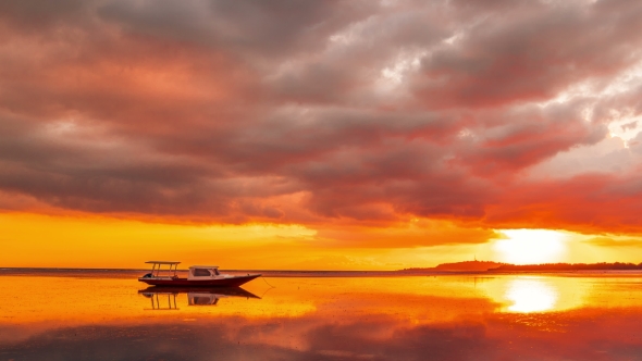 Boat on the Sea at the Orange Sunset of Gili Meno, Indonesia alt